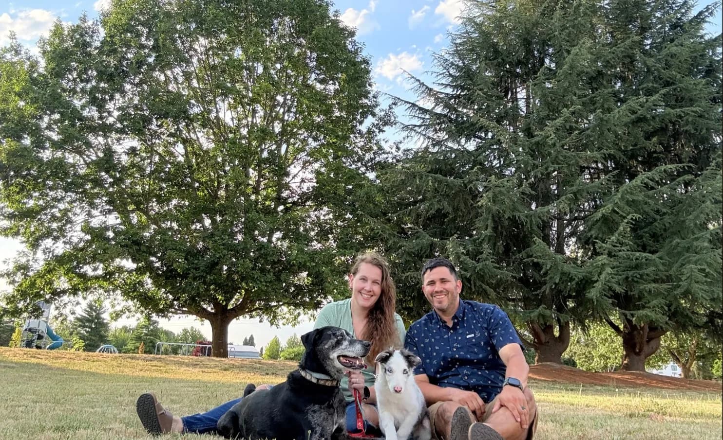 Michael and Jessie at the park with their dogs Auri and their puppy